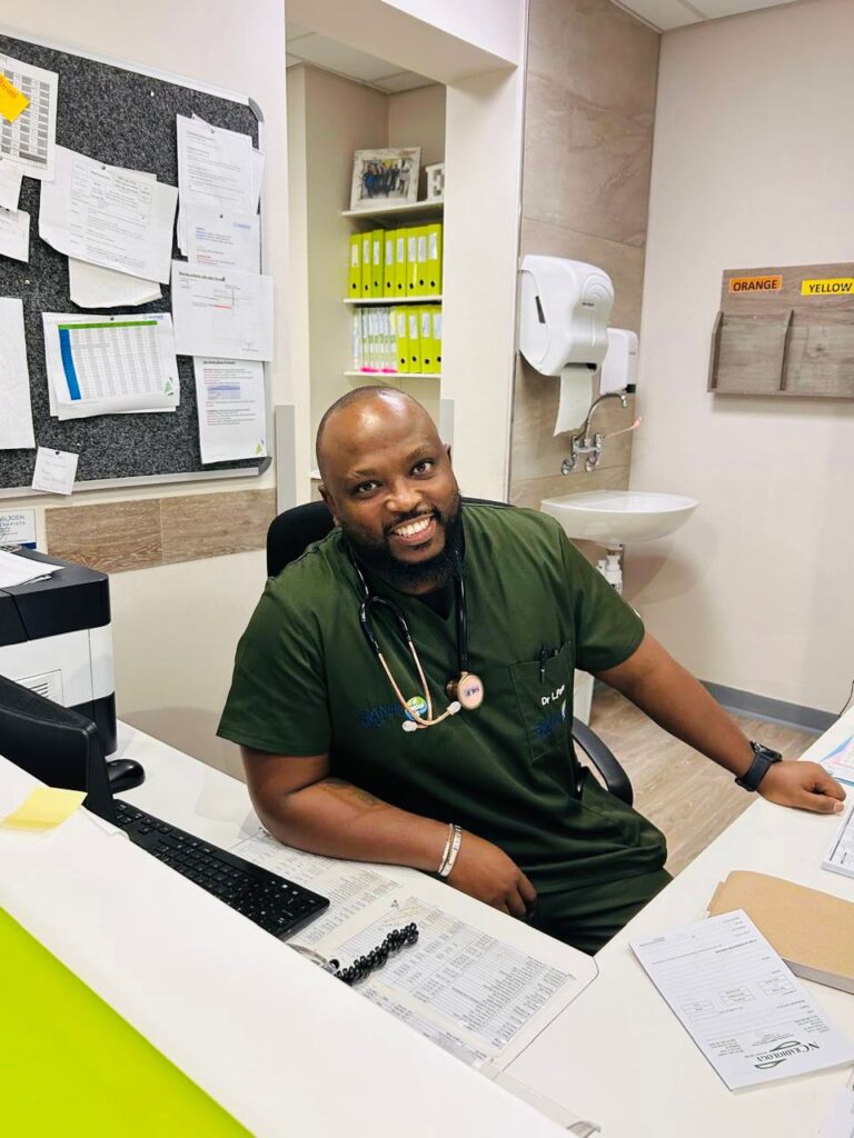 Dr Lorato Pata sitting at a desk